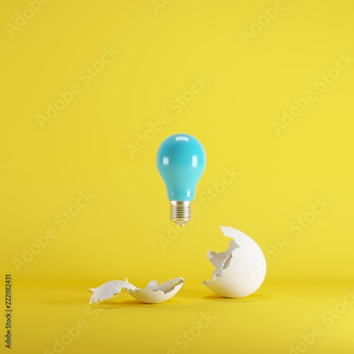 Blue lightbulb floating born from white Egg on yellow blackground. minimal idea concept.
