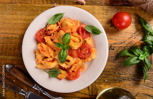 Traditional italian dish - tortellini with tomato sauce
