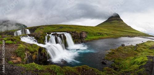 Panoramic view of Kirkjufellfoss and Kirkjufell mountain in cloudy day ,Iceland.