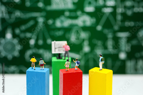 Miniature people : children studying with teacher using for concept of World teacher Day. photo