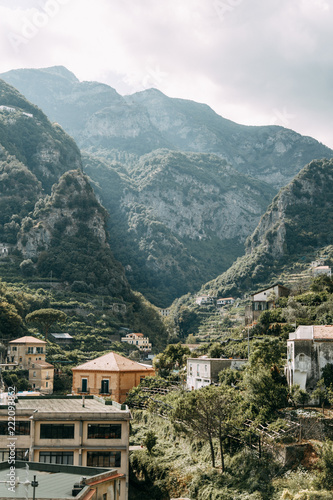 The Amalfi coast and the mountain slopes with plantations of lemons. Panoramic view of the city and nature of Italy. Evening landscapes and winding roads © pavelvozmischev