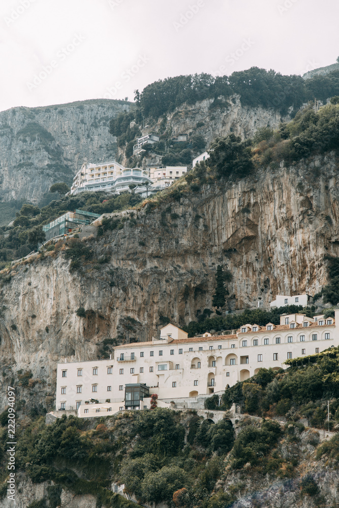 Obraz premium Amalfi coast in Italy, the most beautiful city. Streets and old architecture, narrow passages, shops and cafes. View from the sea and above