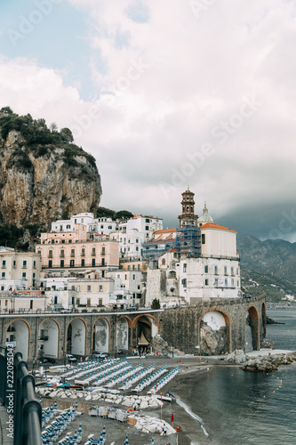 The Amalfi coast and the mountain slopes with plantations of lemons. Panoramic view of the city and nature of Italy. Evening landscapes and winding roads photo