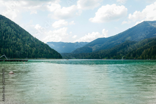 Fantastic views of the tranquil lake with amazing reflection. Mountains & glacier in the background. Peaceful & picturesque landscape. Location: Austria, Europe. Artistic picture. Beauty world. Rain