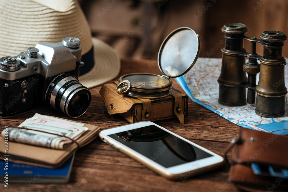 Mobile phone with blank screen on wooden table background. Looking image of traveling concept. Mobile phone with blank screen on wooden table background. Looking image of traveling concept.