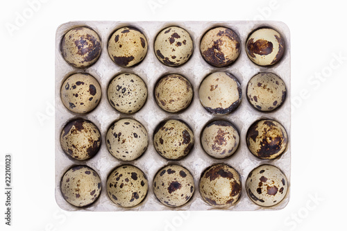 packing of quail eggs, 20 pieces, isolated on white background, top view.