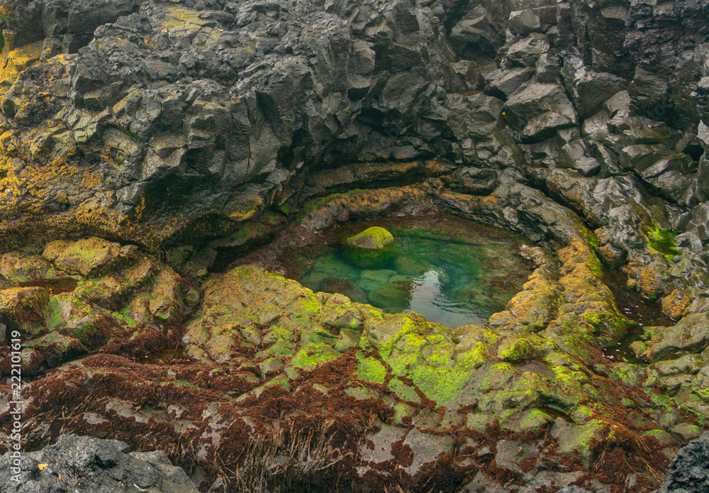 Brimketill naturally carved pool and lava beach in Reykjanes Penninsula, Iceland Brimketill naturally carved pool and lava beach in Reykjanes Penninsula, Iceland