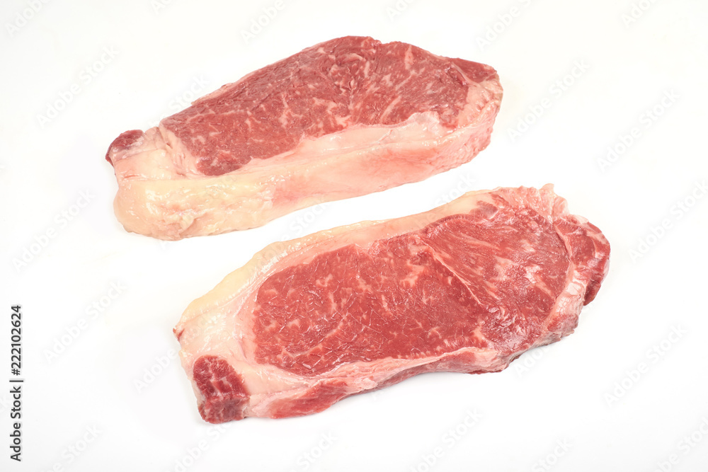 fresh raw steak isolated on white background. fresh raw steak isolated on white background.