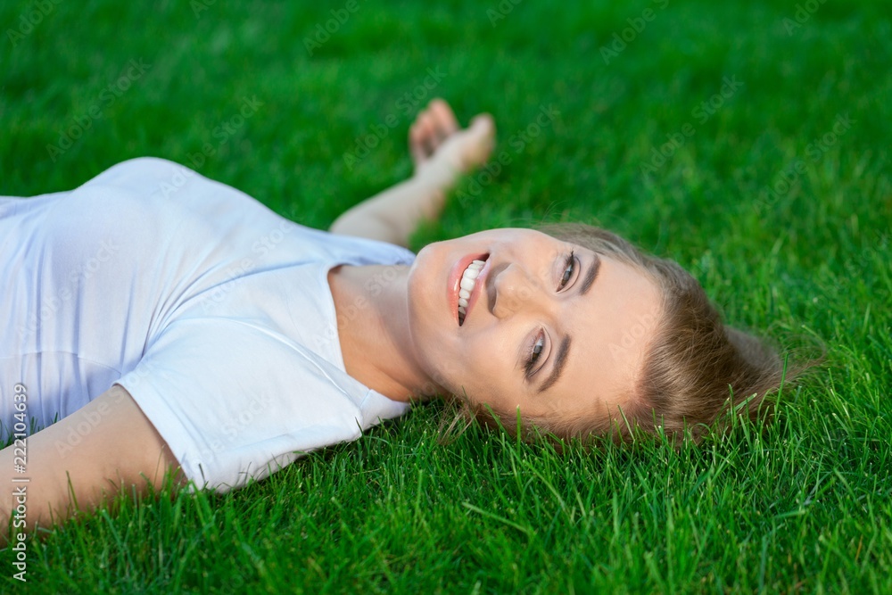 Portrait of a Woman Lying Down on the Grass Portrait of a Woman Lying Down on the Grass
