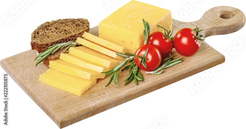 Yellow Cheese, Tomatoes and Bread on the Cutting Board -