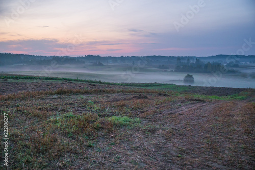 Early morning with sunlight, meadow, trees and fog. Nature photo. Travel photo 2018. photo