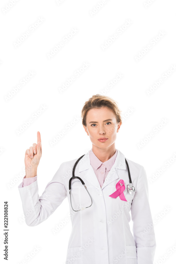 doctor with pink ribbon pointing up with finger and looking at camera isolated on white, breast cancer awareness concept doctor with pink ribbon pointing up with finger and looking at camera isolated on white, breast cancer awareness concept
