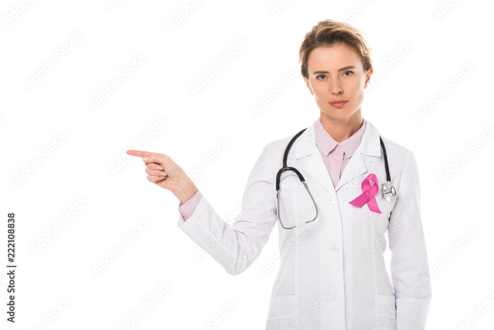 doctor with pink ribbon pointing with finger and looking at camera isolated on white, breast cancer awareness concept doctor with pink ribbon pointing with finger and looking at camera isolated on white, breast cancer awareness concept
