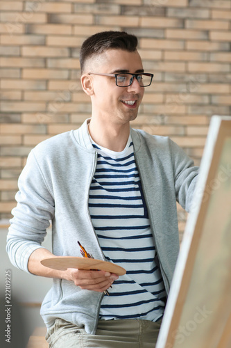 Young Male Artist Painting ...