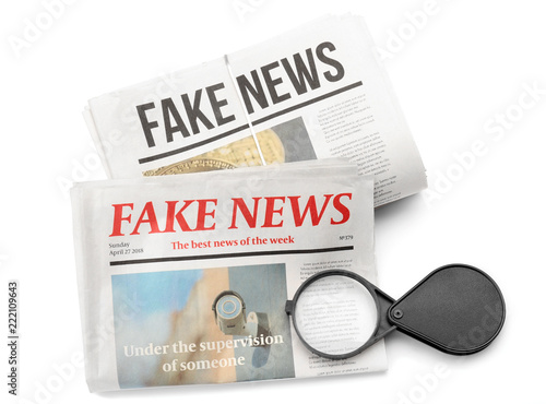 Magnifying glass with newsp...