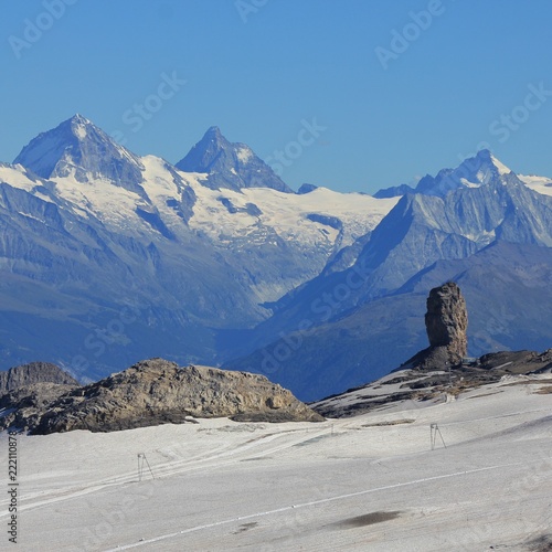 Quille Du Diable, unique rock next to the Tsanfleuron Glacier. Distant view of the Matterhorn. photo