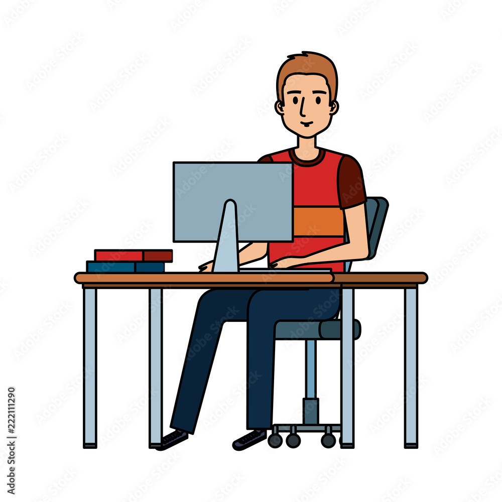 young man at desk with computer young man at desk with computer