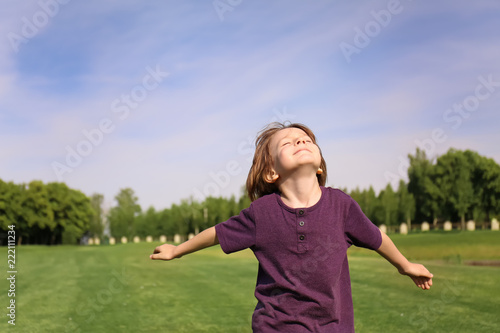 Cute little boy relaxing in...