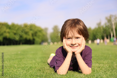 Cute little boy relaxing in...