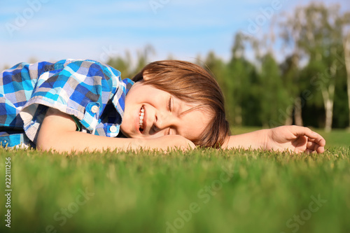 Cute little boy relaxing in...