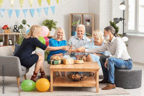Mature people celebrating b...