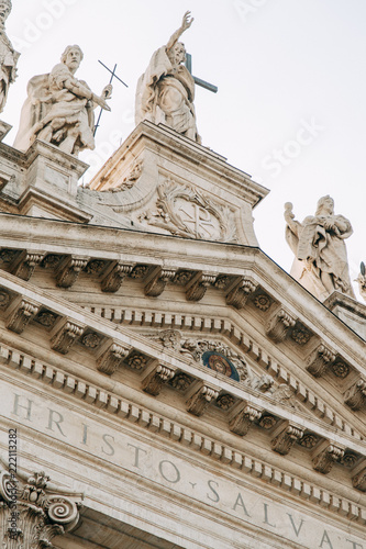 Salvatore Church in Rome  view from outside and inside. Frescoes and statues  architectural elements. A historic landmark  tourist destination. Ancient painting