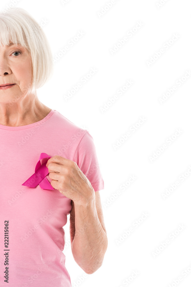 cropped shot of senior woman in pink t-shirt with breast cancer awareness ribbon looking at camera isolated on white cropped shot of senior woman in pink t-shirt with breast cancer awareness ribbon looking at camera isolated on white