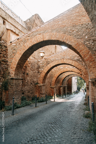 The architecture of Rome and the Italian style in stucco. Sights of the old town, tourist places. Street art, world heritage. Miracle of light. Carved columns and capitals. Ancient structure