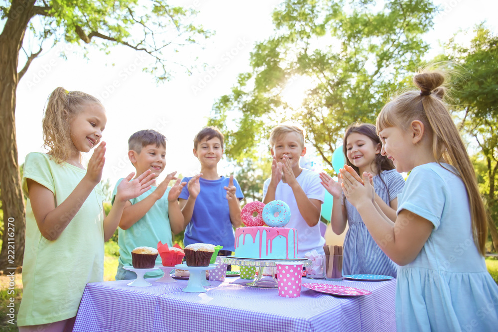 Cute little children celebrating Birthday outdoors Cute little children celebrating Birthday outdoors