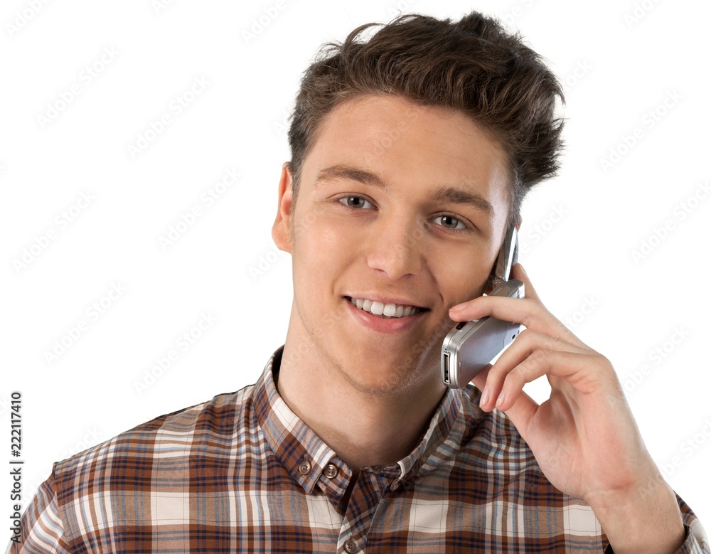 Young man talking on his cell phone Young man talking on his cell phone