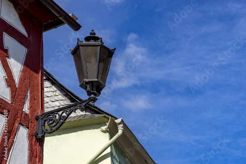 Ancient streets lantern on house wall