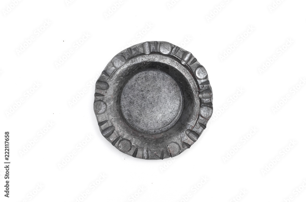 Retro leaden candle holder in form of circle shape isolated on white background.