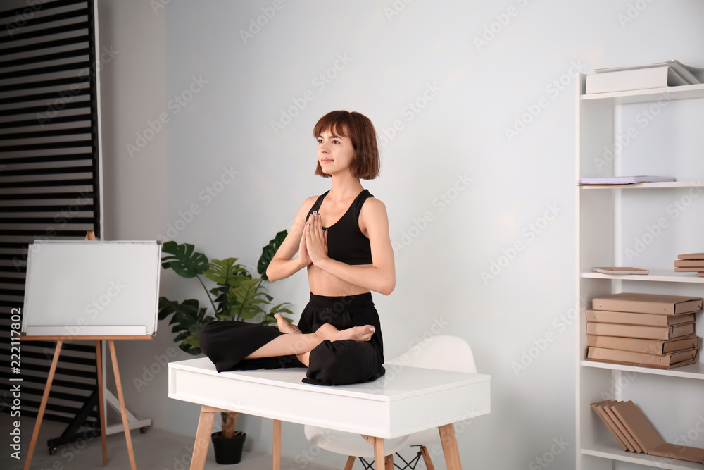 Sporty woman practicing yoga at home Sporty woman practicing yoga at home