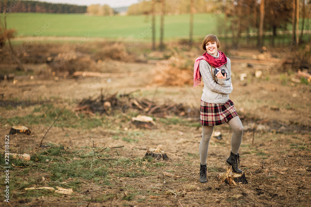 young beautiful brunette girl with a beautiful face and figure, hipster, retro posing with a camera outdoors, taking pictures, woman, photographer, vintage camera, outdoor portrait young beautiful brunette girl with a beautiful face and figure, hipster, retro posing with a camera outdoors, taking pictures, woman, photographer, vintage camera, outdoor portrait