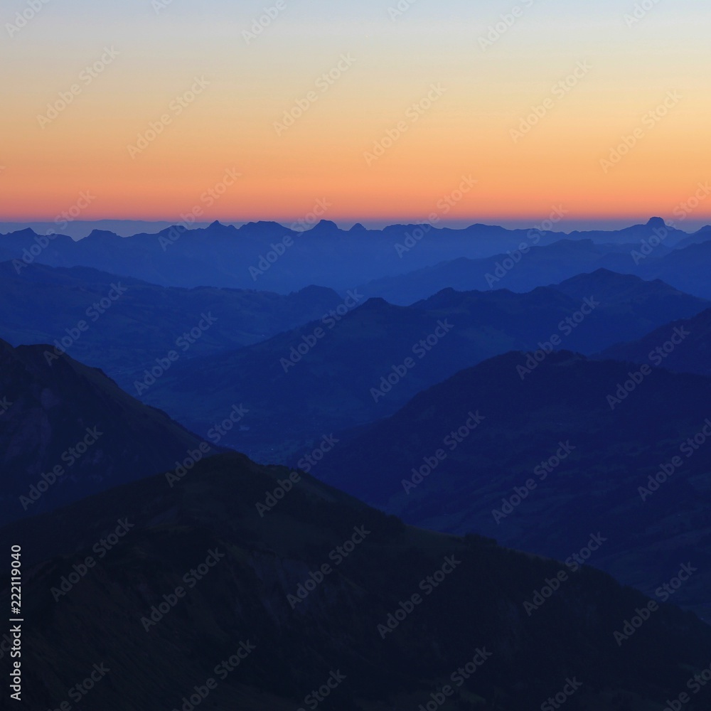 Saanenland Valley and mountains in the Bernese Oberland at sunrise.