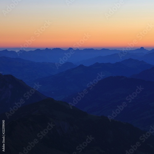Fototapeta Naklejka Na Ścianę i Meble -  Saanenland Valley and mountains in the Bernese Oberland at sunrise.