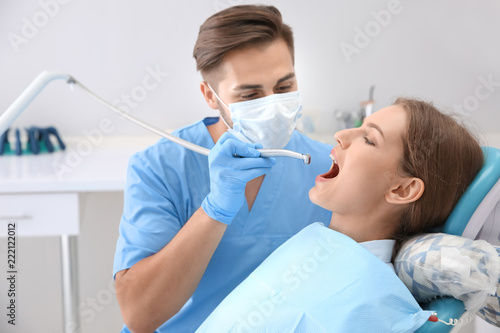 Dentist filling patient's t...
