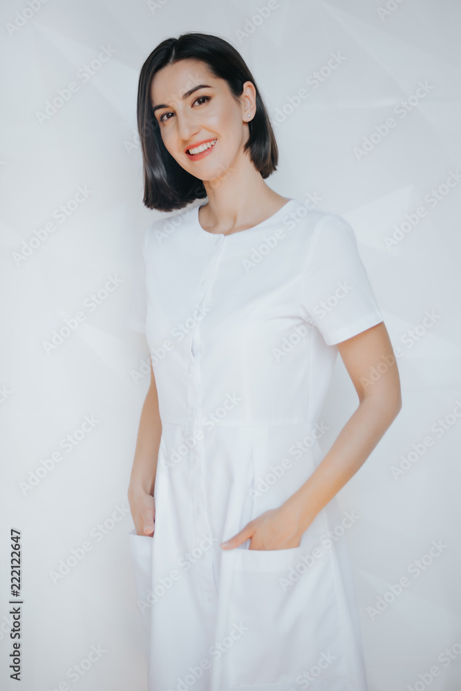 Smiling confident beautician posing in clinic of esthetic medicine.Smiling confident beautician posing in clinic of esthetic medicine Smiling confident beautician posing in clinic of esthetic medicine.Smiling confident beautician posing in clinic of esthetic medicine