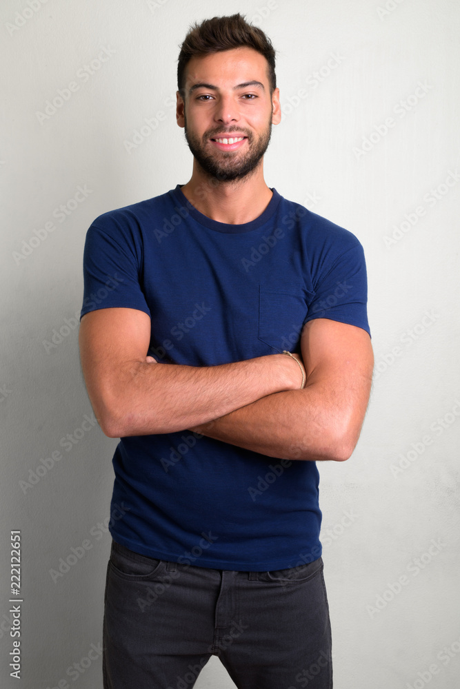 Studio shot of young handsome bearded man Studio shot of young handsome bearded man