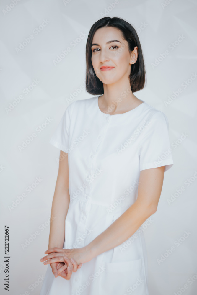 Smiling confident beautician posing in clinic of esthetic medicine.Smiling confident beautician posing in clinic of esthetic medicine Smiling confident beautician posing in clinic of esthetic medicine.Smiling confident beautician posing in clinic of esthetic medicine