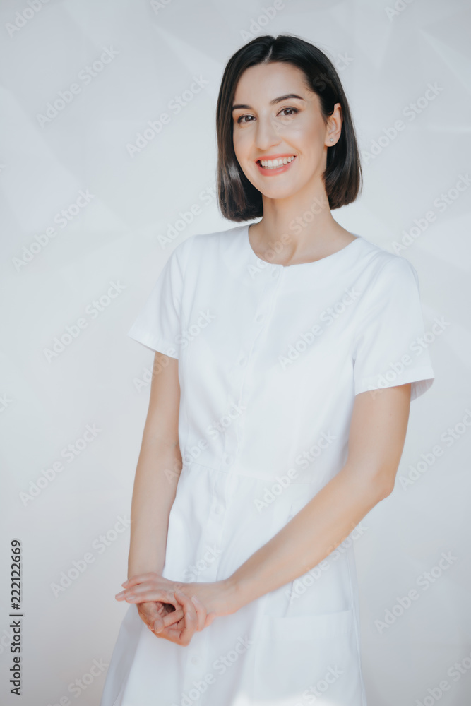 Smiling confident beautician posing in clinic of esthetic medicine.Smiling confident beautician posing in clinic of esthetic medicine Smiling confident beautician posing in clinic of esthetic medicine.Smiling confident beautician posing in clinic of esthetic medicine