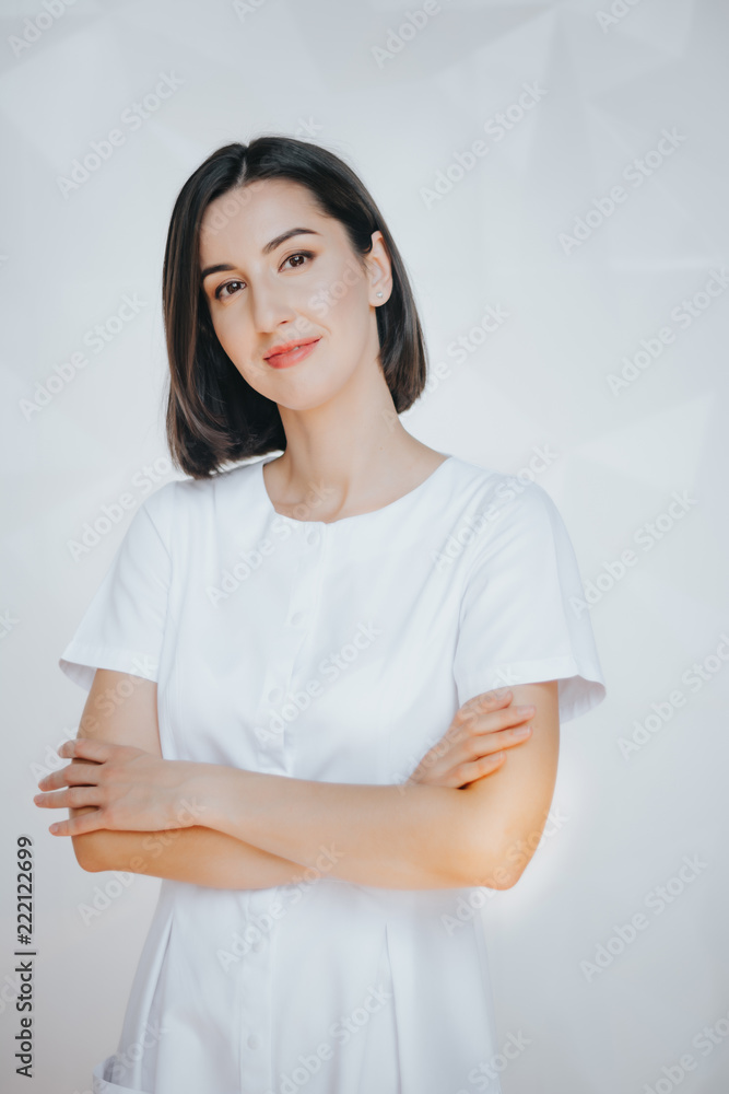Smiling confident beautician posing in clinic of esthetic medicine.Smiling confident beautician posing in clinic of esthetic medicine Smiling confident beautician posing in clinic of esthetic medicine.Smiling confident beautician posing in clinic of esthetic medicine