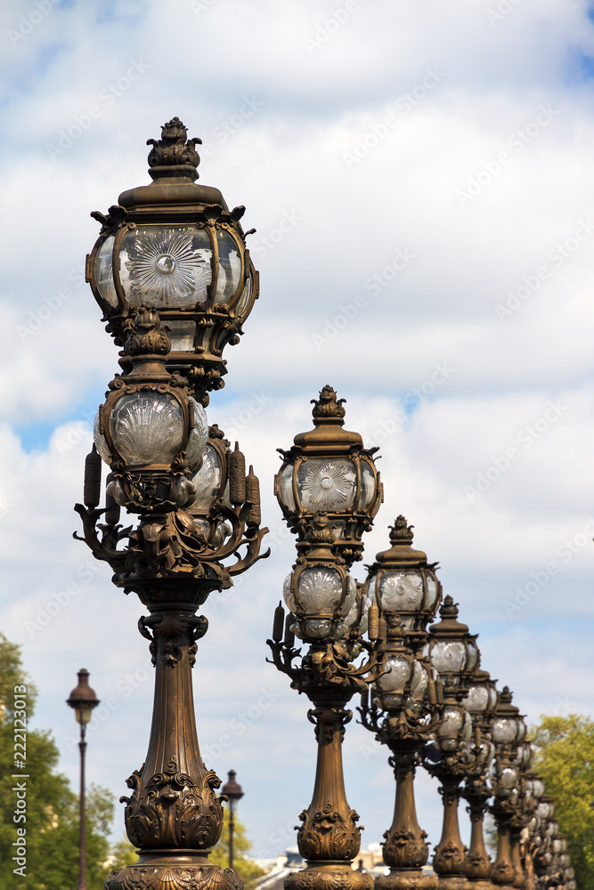Ornate lanterns at the Pont Alexandre III in Paris, France