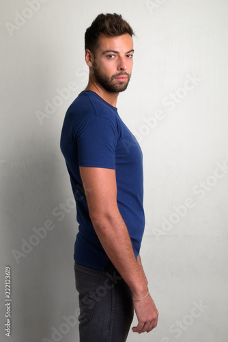 Studio shot of young handsome bearded man © Ranta Images