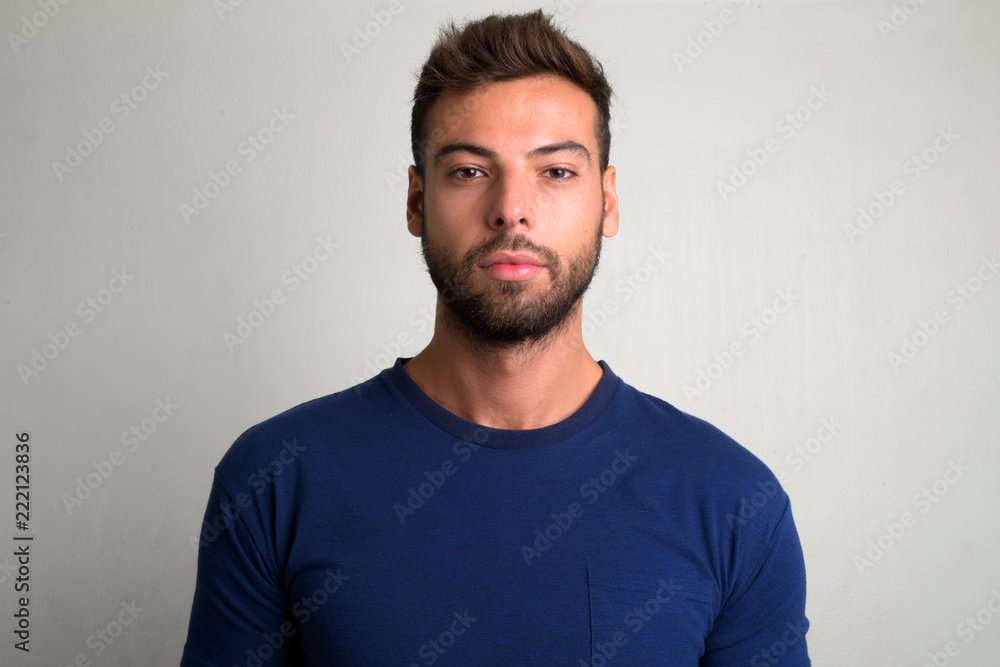 Studio shot of young handsome bearded man Studio shot of young handsome bearded man