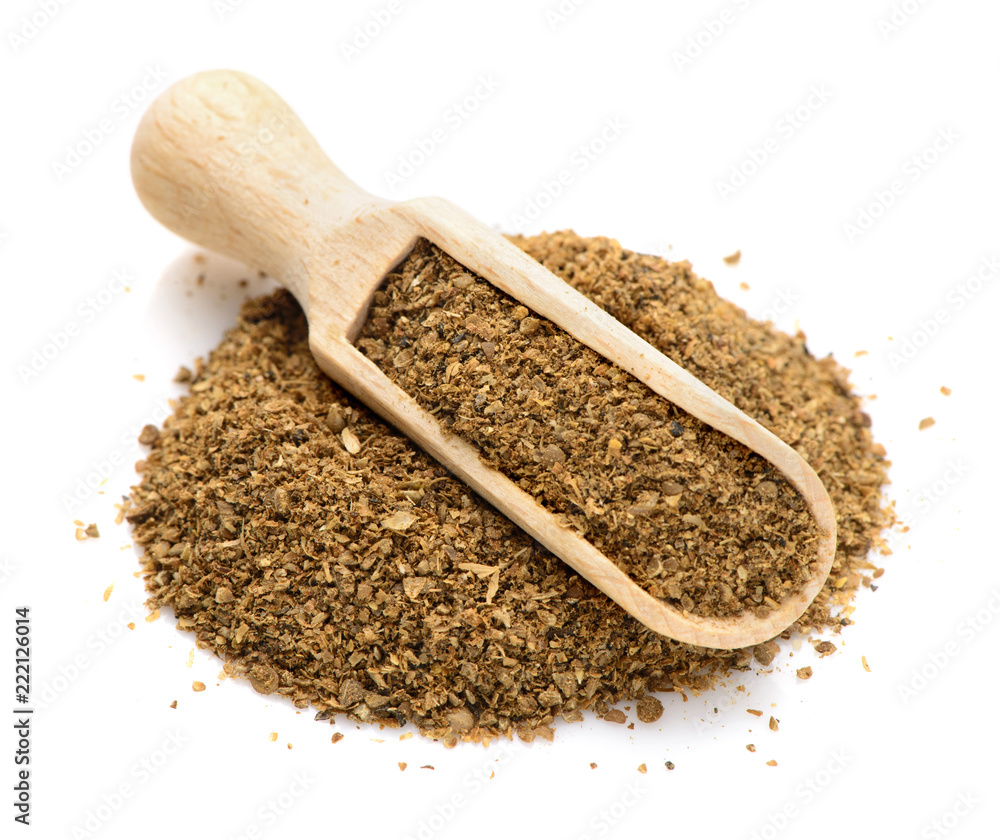 ground coriander in a scoop for spices