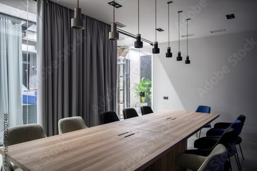 Stylish conference room with gray and glass walls photo