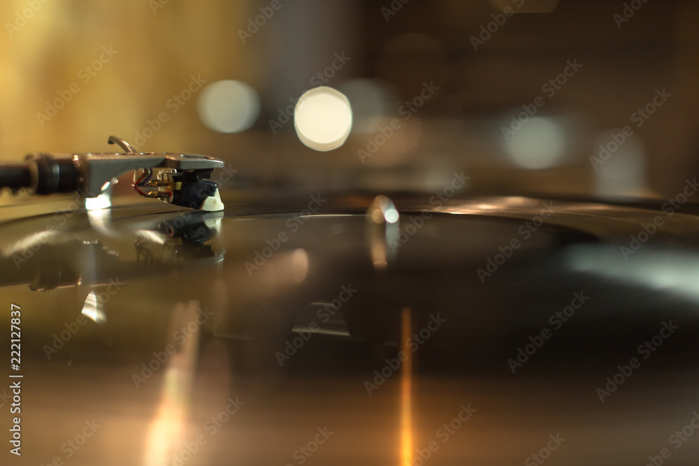 Playing vinyl in the studio on blurred background Playing vinyl in the studio on blurred background
