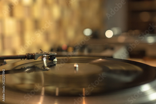 Playing vinyl in the studio on blurred background