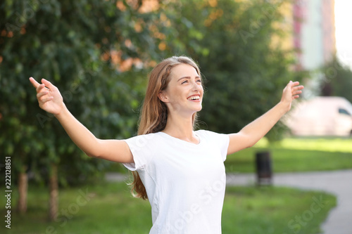 Happy young woman resting i...